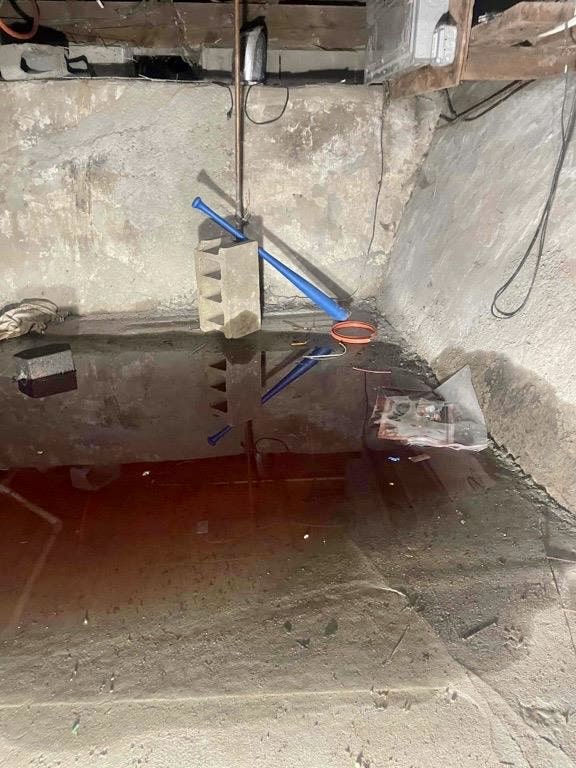 an oil spill in a residential crawl space in Bayport, NY