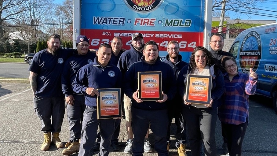 United Water Restoration Long Island team with Best of LI winners plaques
