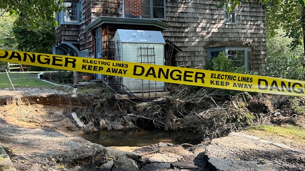 Severe storm damage near house.