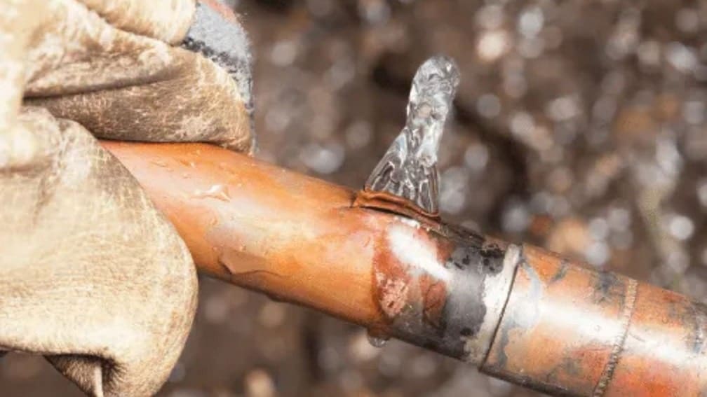 Pipe leaking water from damage