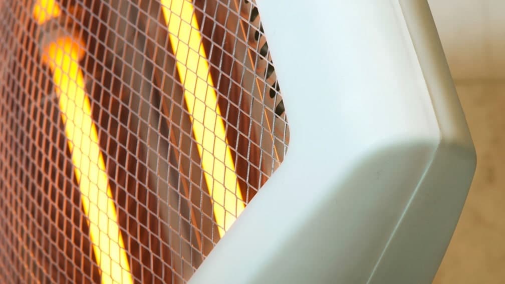 close up of a portable electric space heater that is on